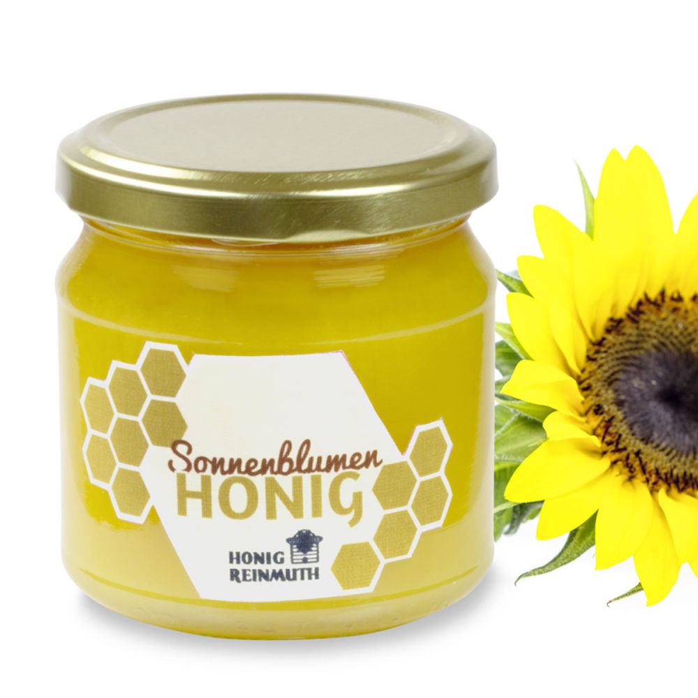 Sonnenblumenhonig im Glas vor einer Sonnenblume